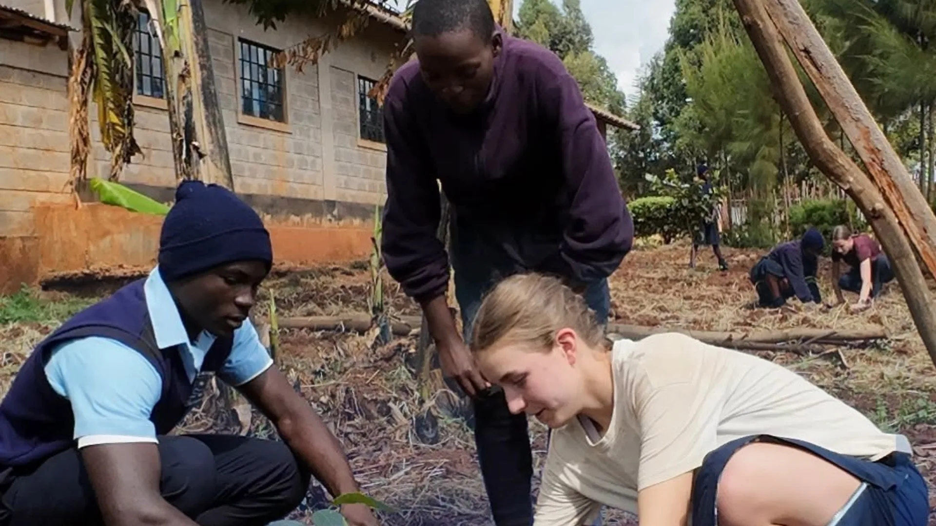 Barney students spending time outdoors with locals in Kenya.