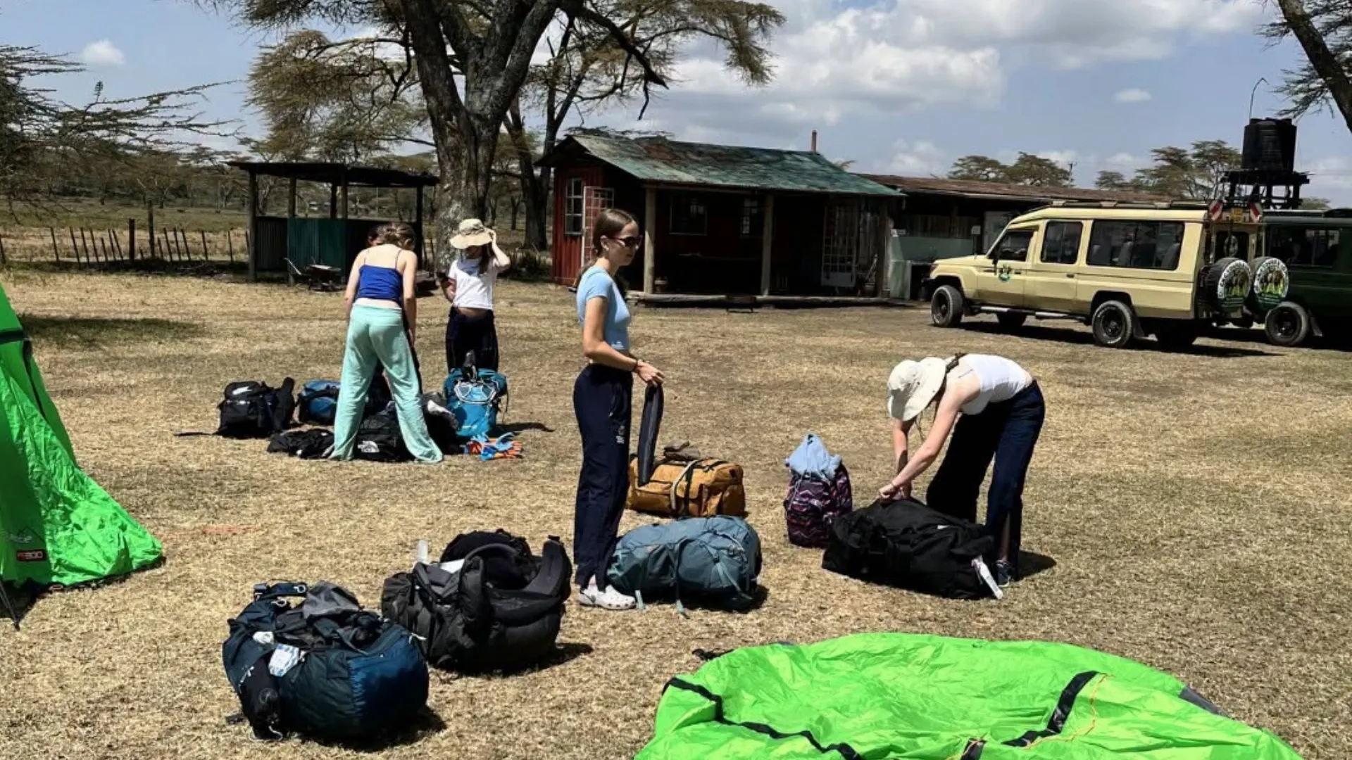 Barney students putting up a tent in Kenya.