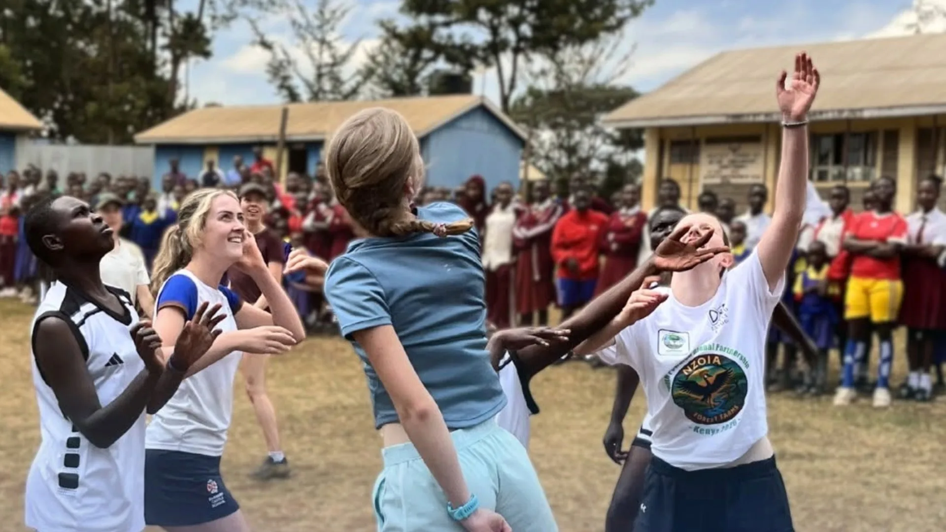 Locals and Barney students playing sports together in Kenya.