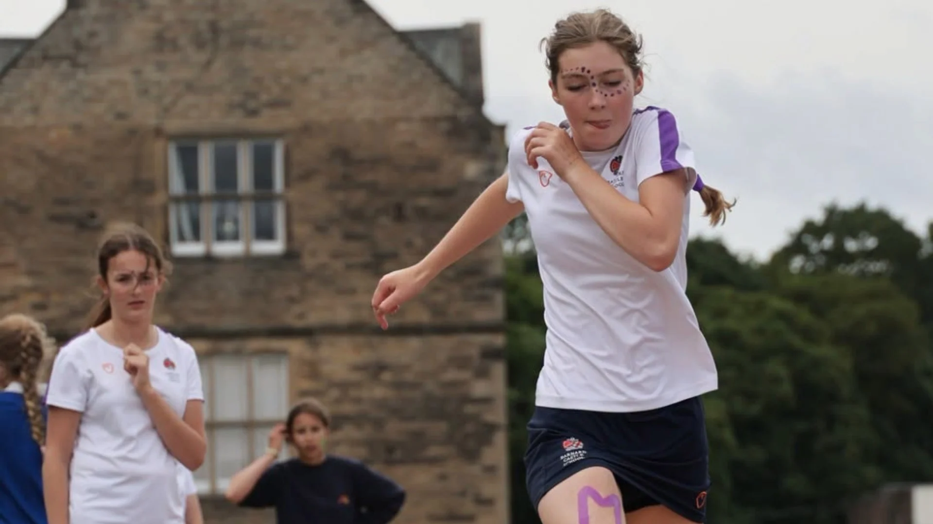 A Senior girl jumping on Senior Sports Day.