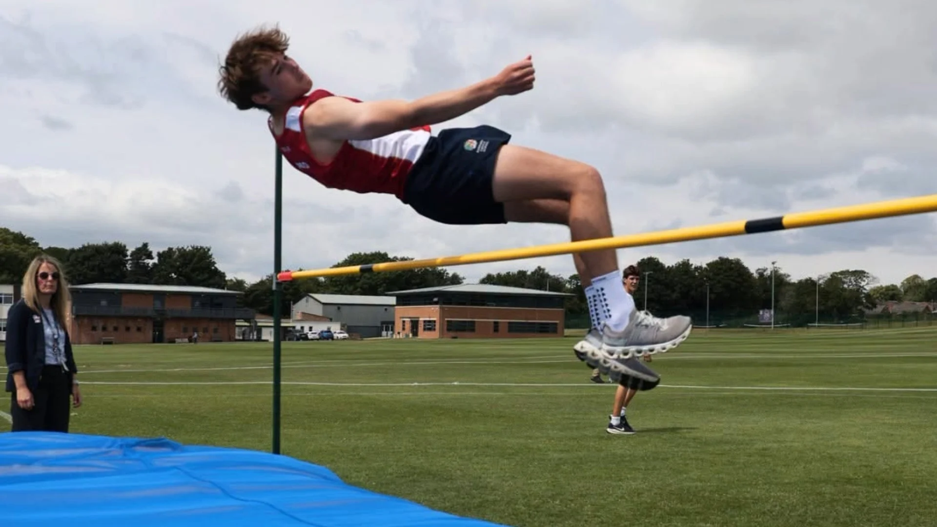A Senior boy pole vaulting on Senior Sports Day.