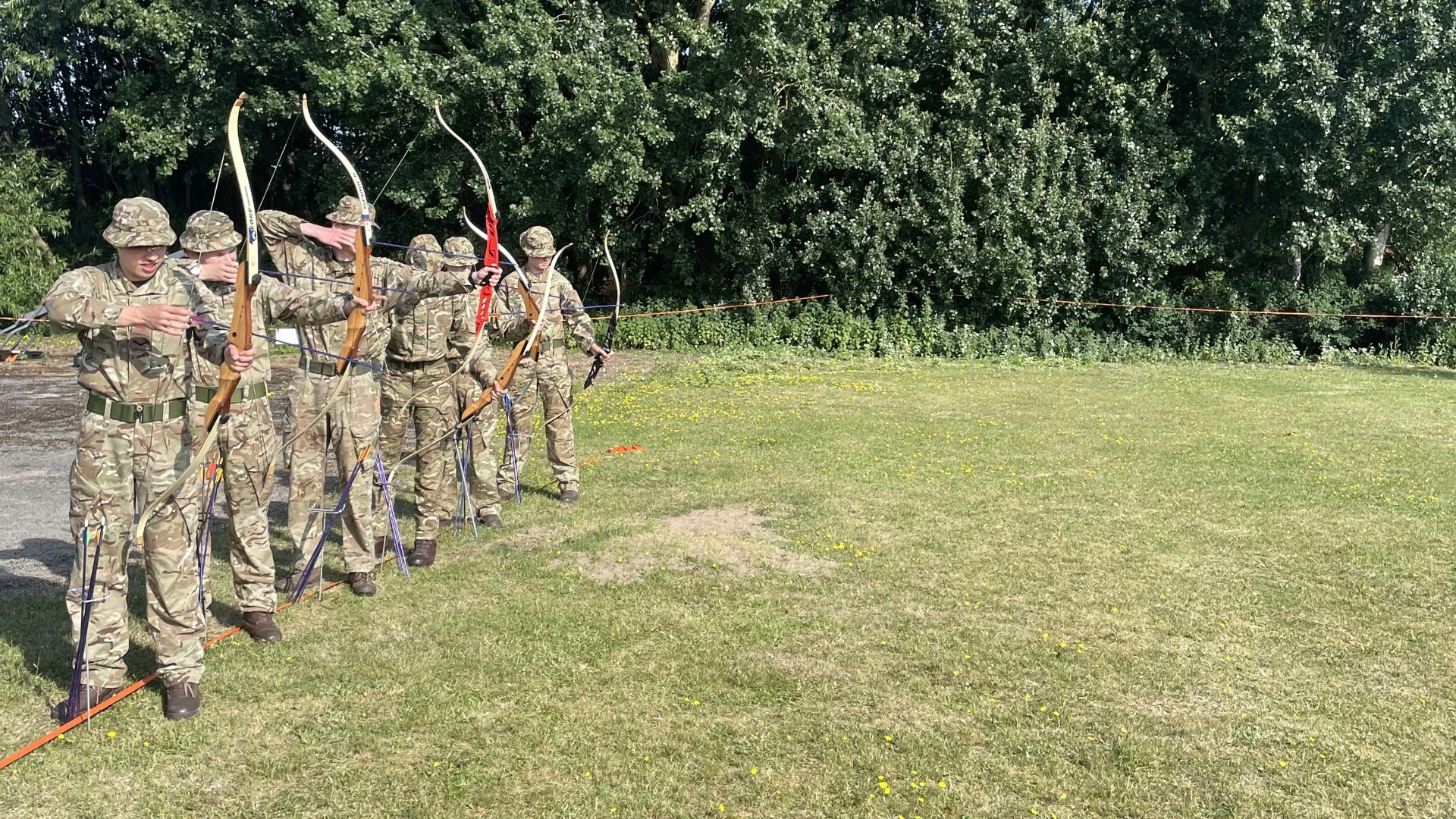 Barney CCF cadets firing bows.
