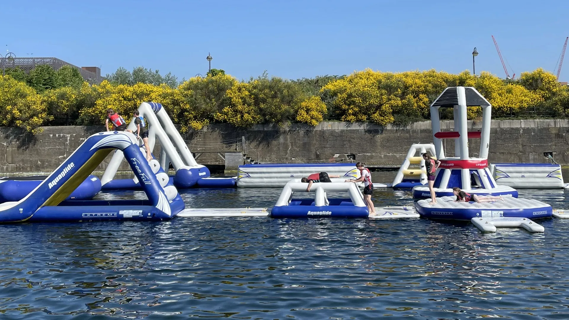 An inflatable obstacle course on water.