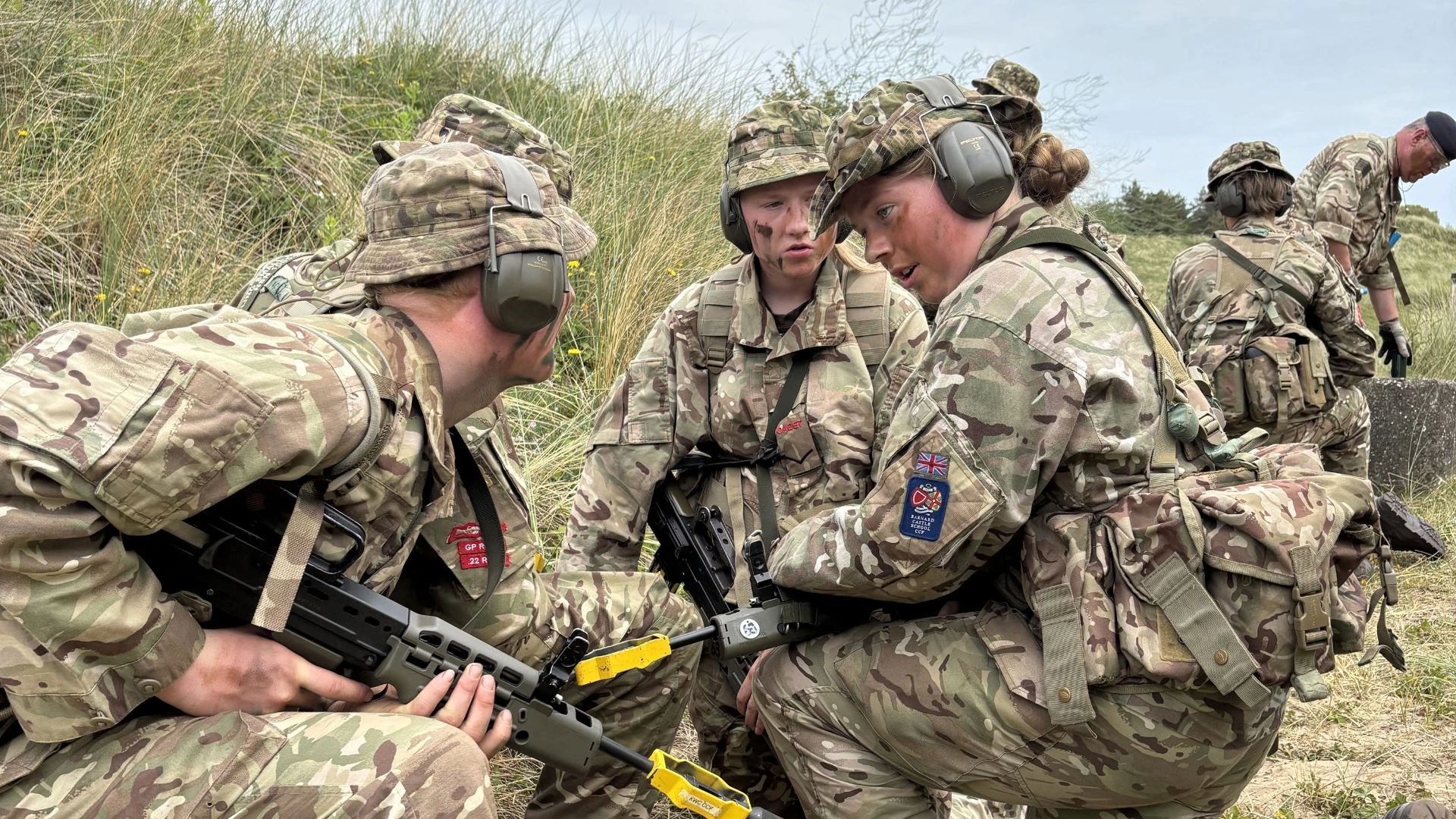 Barney CCF cadets working together in a field.