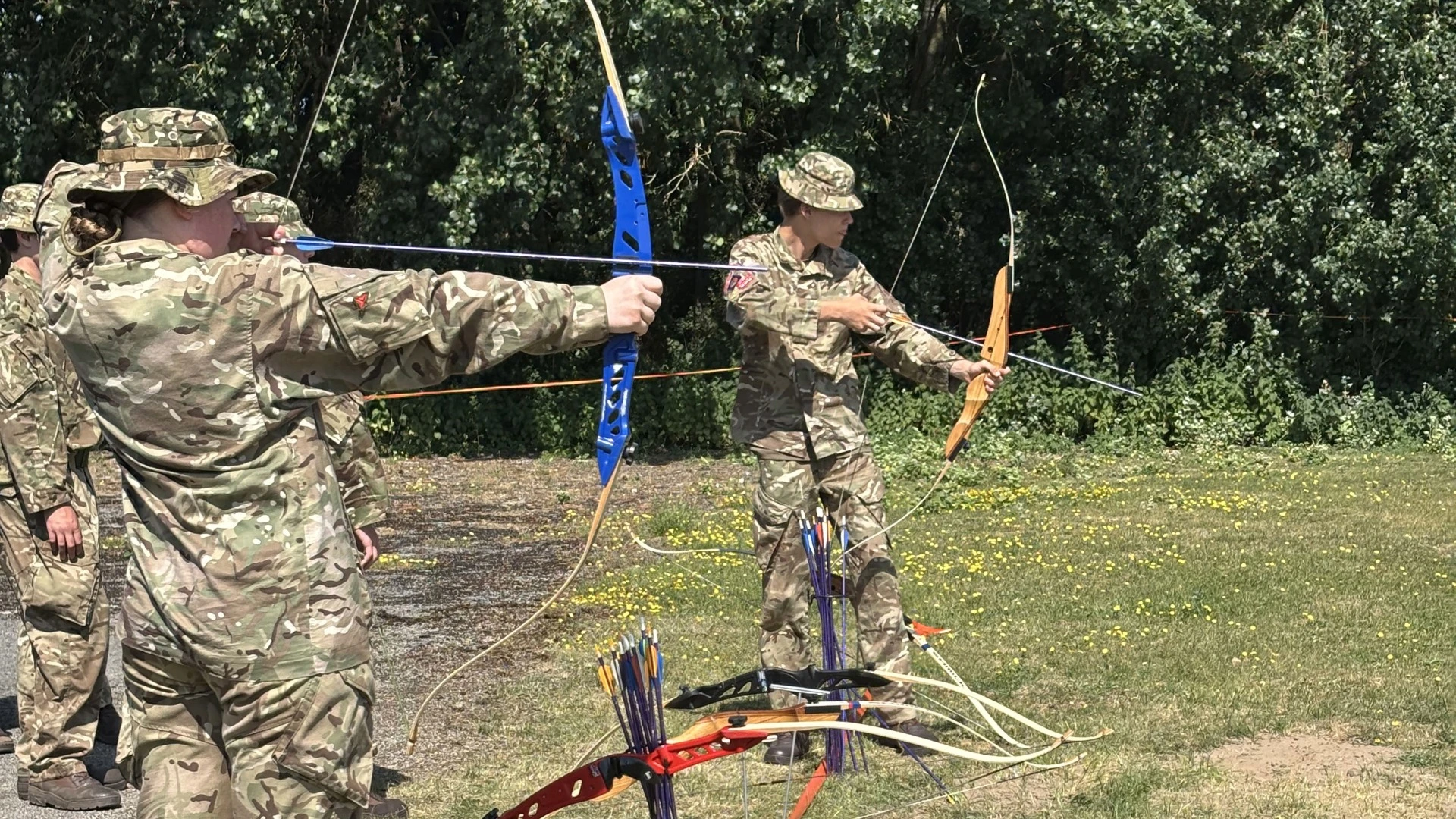 Barney CCF cadets firing bows.