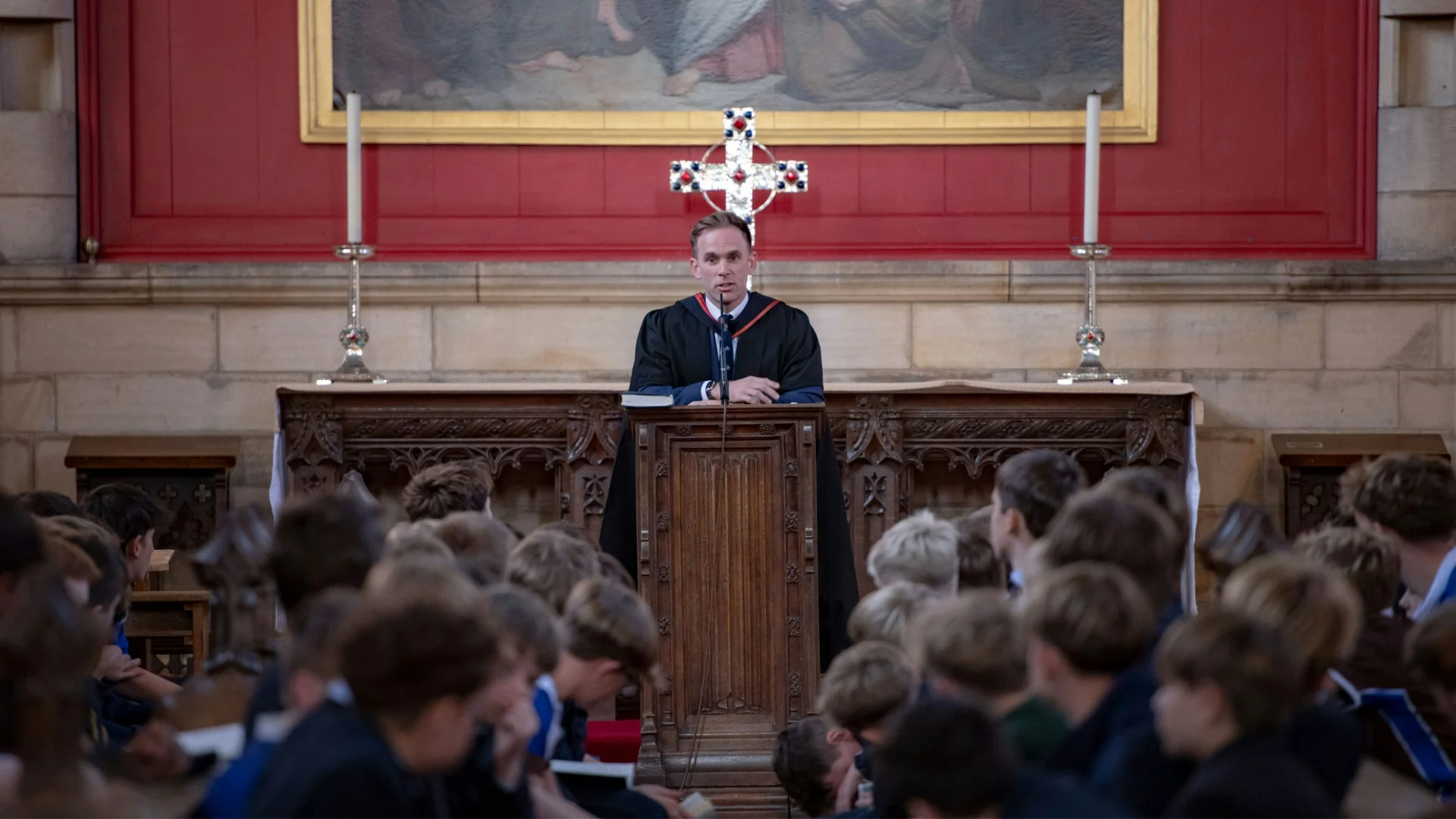 Barnard Castle School's Headmaster, David Cresswell, adressing a chapel full of Barney students in blue uniforms.