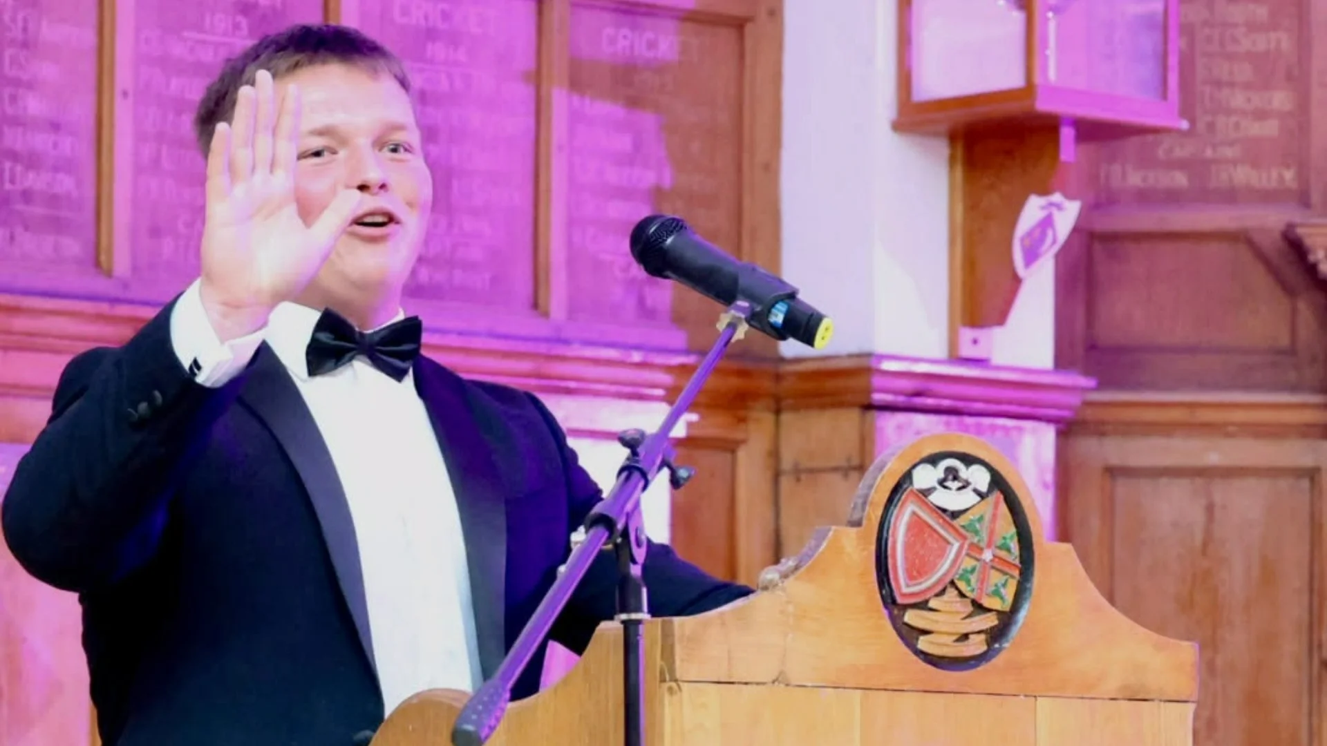 A Barney Sixth Former giving a speech at lectern Club.