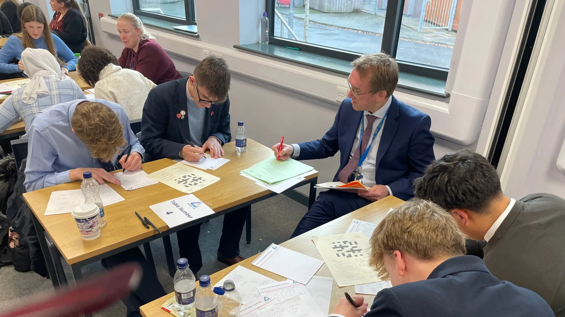 Students working at the UKMT Senior Team Maths Challenge.